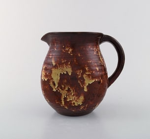 Michael Andersen, Denmark jug with handle. Beautiful glaze in red and yellow shades. 1950 / 60s.