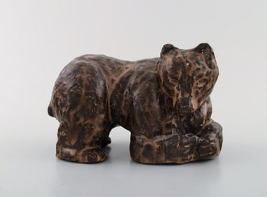 Scandinavian ceramist. Unique figure of brown bear in glazed stoneware. Mid 20th century.