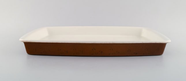 Stig Lindberg for Gustavsberg. Large "Coq" ovenproof tray in glazed stoneware. Rustic design,