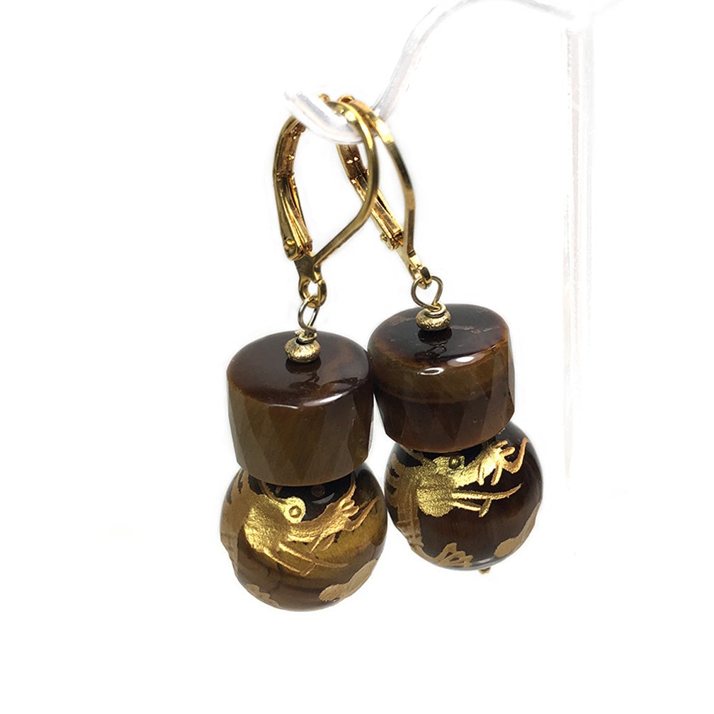 Tiger's Eye Dragon Earrings: This is a pair of tiger's eye dragon earrings. There are carved golden dragons on 15mm tiger's eye spheres and 11 x 8 mm faceted drum shaped tiger's eye beads with brass lever-backs. Let's celebrate T