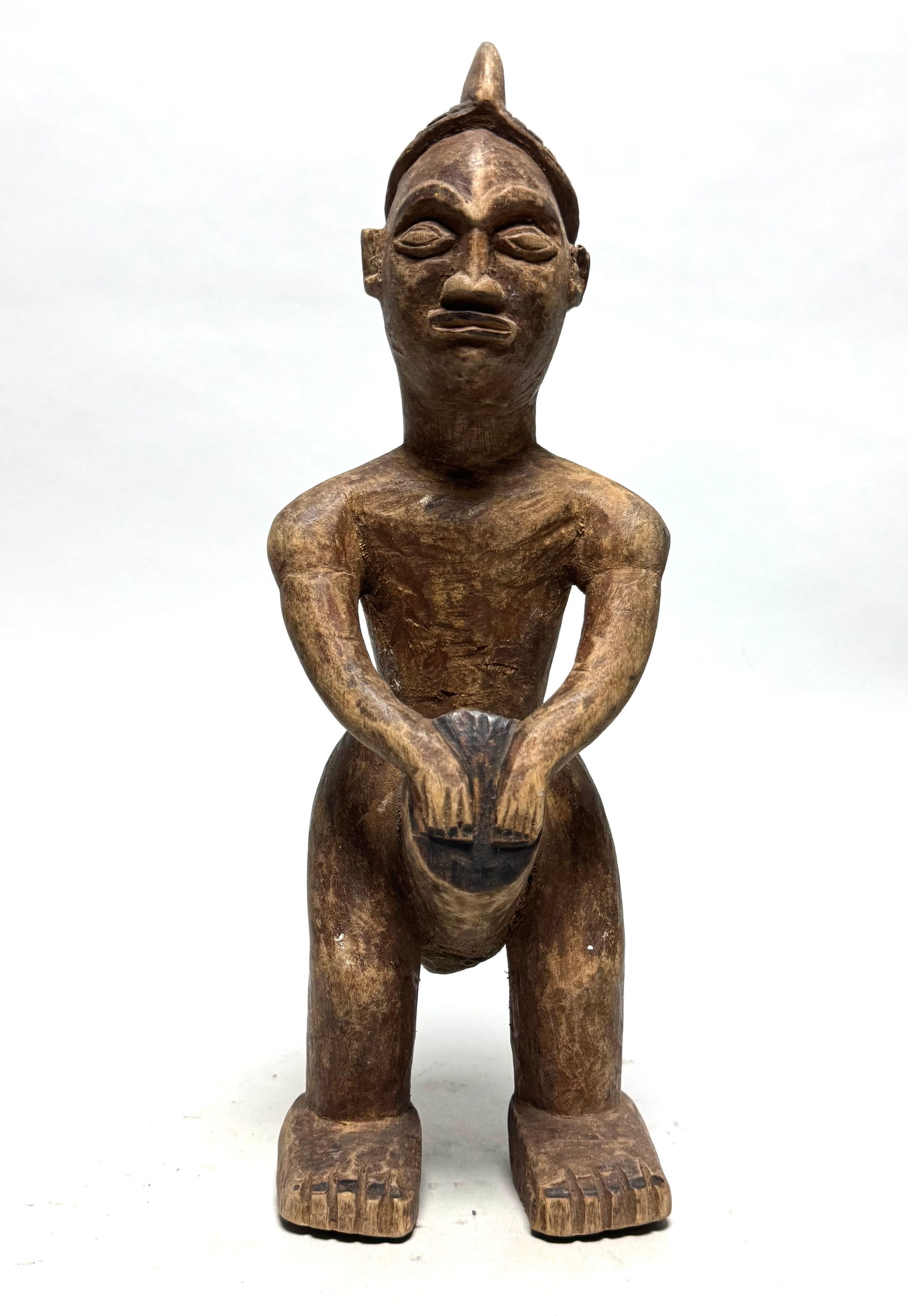 Mbala Drum Figure - DR Congo: This sculpted drummer represents a Sacred Badge of Authority (Pindi). The musician's headdress resembles the mukote headdress, traditionally worn by the Western Pende, with whom the Mbala shared mukan
