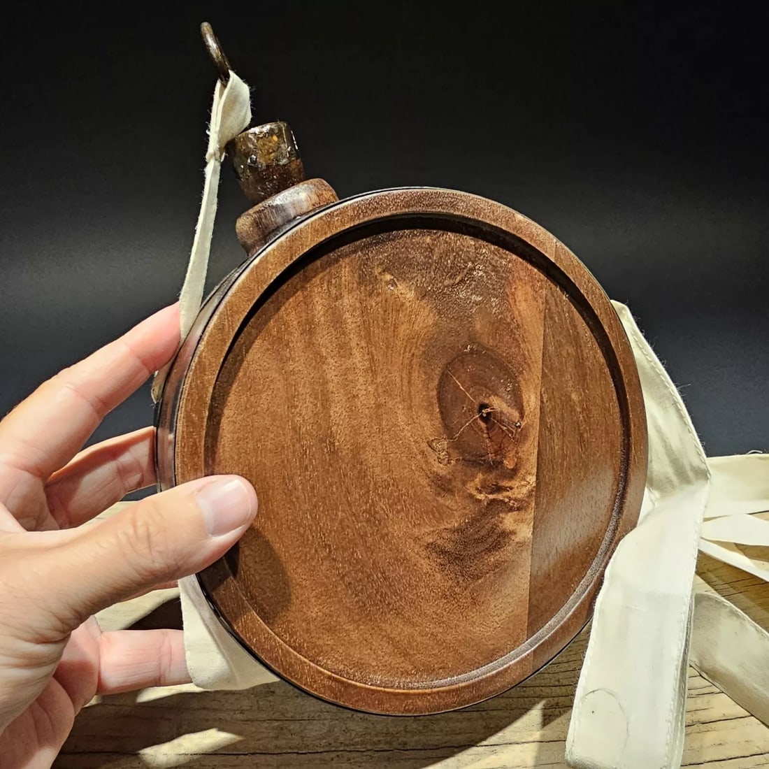 7" Decorative Civil or Rev War Wood Drum Canteen: 7" Round For Decorative Use only Nice replica wood drum canteen. Built slightly rustic to look just like the originals. All wood canteen. Features a muslin cloth strap, metal bands on the sides, and a