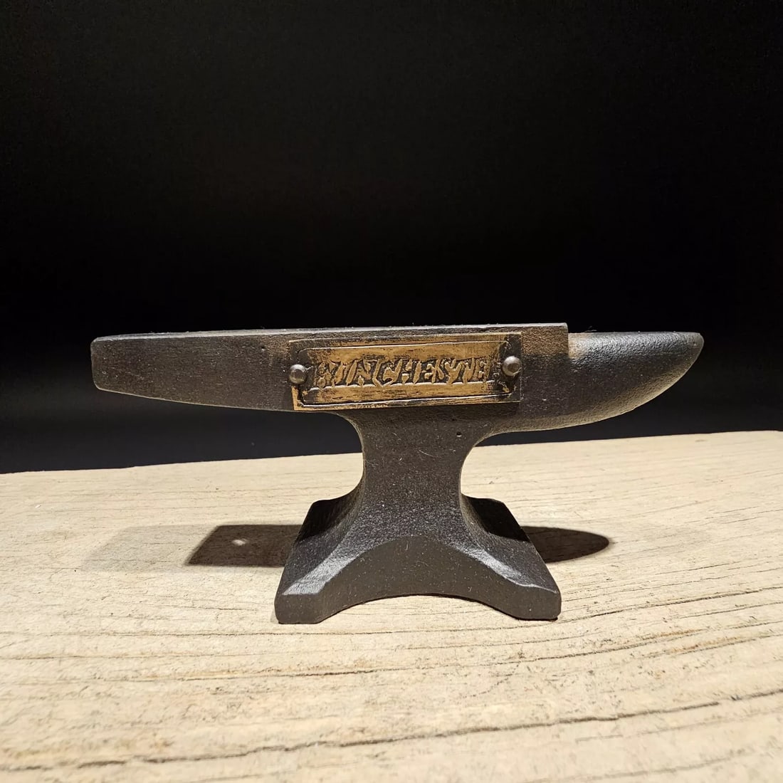 Cast Iron "Winchester" Miniature Anvil: 5 1/2" long x 2 1/2" Tall x 1 3/4" Wide A wonderful reproduction cast iron collectible advertising Winchester anvil. Advertising pieces like this many times were given to shops or used as sales sample