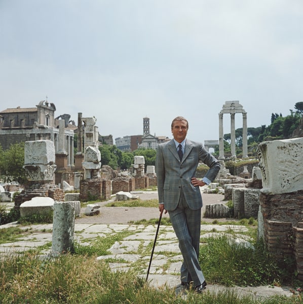 A Roman Prince ' By Slim Aarons Oversized C Type: Description ' A Roman Prince ' by Slim Aarons circa 1982: Prince Raimondo Orsini d'Aragona stands in the ancient Roman forum wearing an elegant suit by tailor Savini-Brioni. (Photo by Slim Aarons/Gett