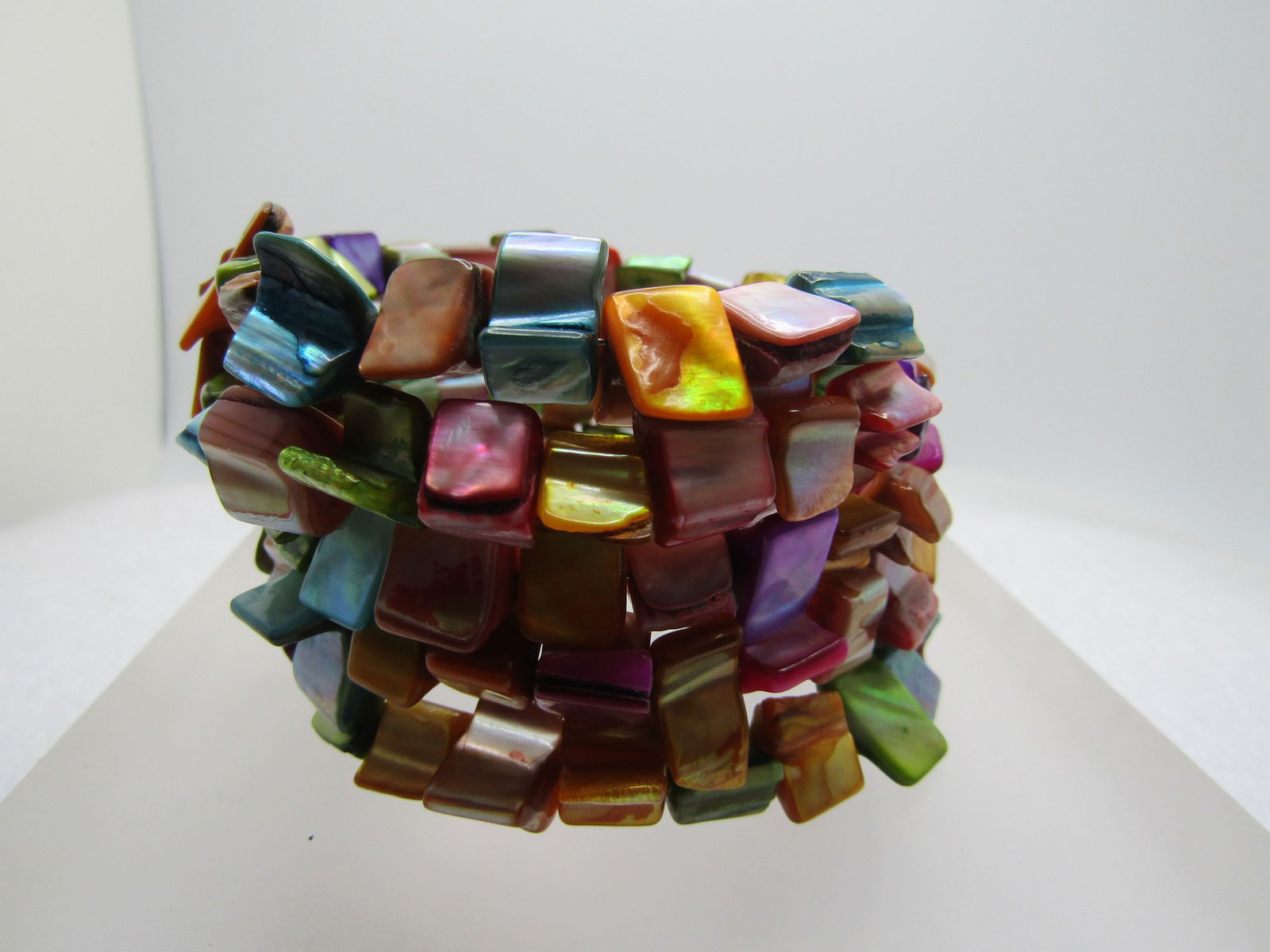 Vintage Dyed Shell Coiled Bracelet, 7", 1980's-1990's: Vintage Dyed Shell Coiled Bracelet, 7", 1980's-1990's. Nice boho appeal too. This has four and a half coils of dyed mother-of-pearl nuggets that are in appealing shades of teal; shades of pink; teal;