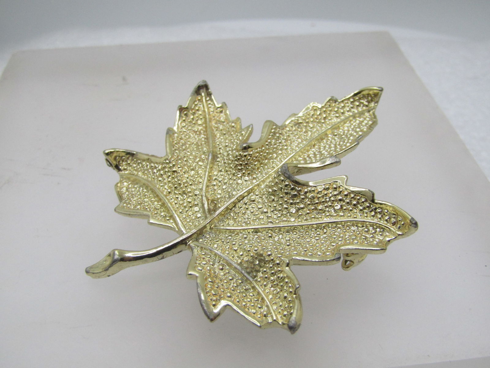 Vintage Coro Leaf Brooch, 1960's, Gold Tone: Vintage Coro Leaf Brooch, 1960's, Gold Tone. It is appx. 2.5" tall and 2" wide. It is signed Coro on the back. Light wear and good to very good condition. (W8523.5 SS11636 J LD 8/18/23). Reserve: $30.