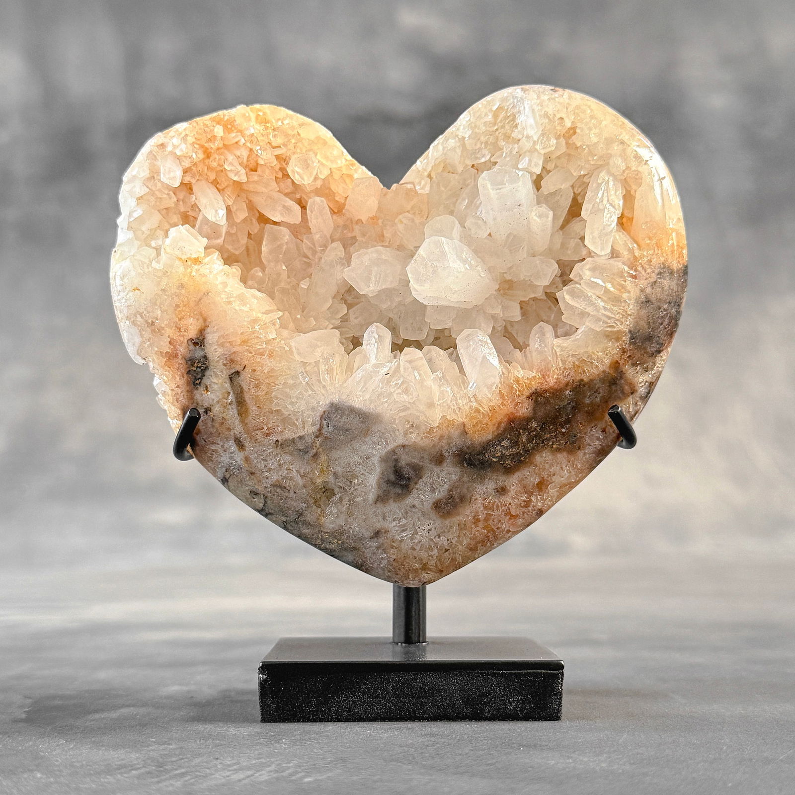 Wonderful crystal quartz heart with a custom stand: Title:Wonderful crystal quartz heart with a custom stand Maker:Unknown Origin: Indonesia Date/Period:2024 Materials:Crystal quartz, steel Dimensions:Height including stand: 13.9 cm / 5.4 inches Width: