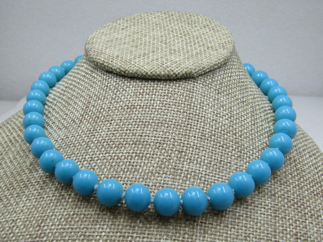 Vintage Japan Turquoise Glass Beaded Necklace, 16": Vintage Japan Turquoise Glass Beaded Necklace, 16", mid-century, knotted between each bead that is appx. 9.5mm. Box clasp with an oval glass turquoise bead. Signed Japan on the clasp. Good condition,