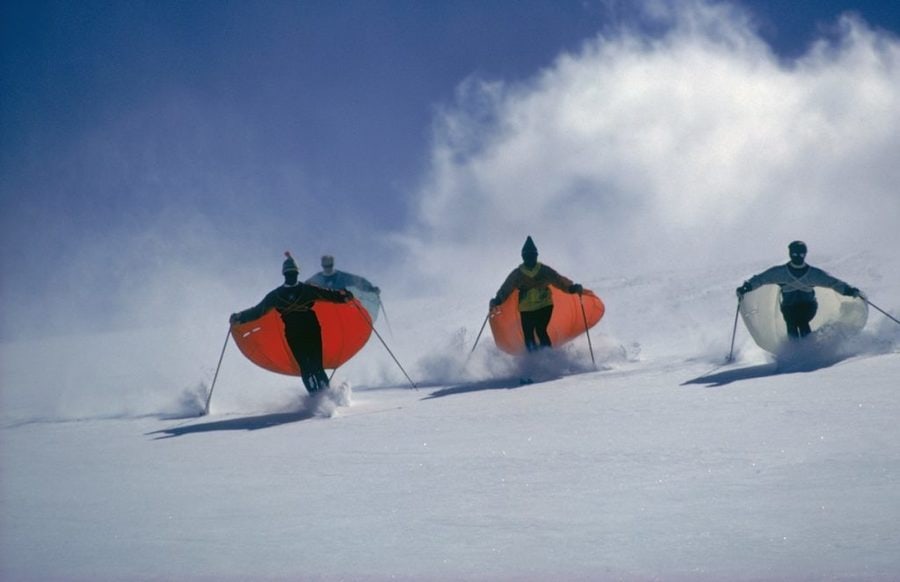 Slim Aarons 'Caped Skiers' 1967 Oversize Unframed C Type Print: Description Slim Aarons 'Caped Skiers' 1967 Oversize Unframed c type print Led by skimaster Stein Eriksen, skiers ‘sail’ down a slope at Snowmass-at-Aspen, Colorado, circa 1967. The skiers