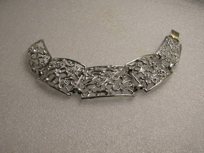 Vintage Silver Tone Floral Bracelet, Graduated, Signed Tara, 7.5", 1960's: Vintage Silver Tone Floral Bracelet, Graduated, Signed Tara, 7.5", 1960's. Five graduated tile links slightly domed with open scroll and floral designs. It is 1-1/8" wide at top center link which is a