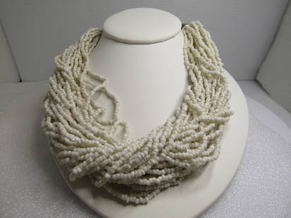 Vintage Multi-Strand White Beaded Necklace, 18" 1970's-1980's: Vintage Multi-Strand White Beaded Necklace, 18" 1970's-1980's. This has over thirty strands of white glass seed beads with long tapered ridged conical ends. This has a hook clasp originally but also h