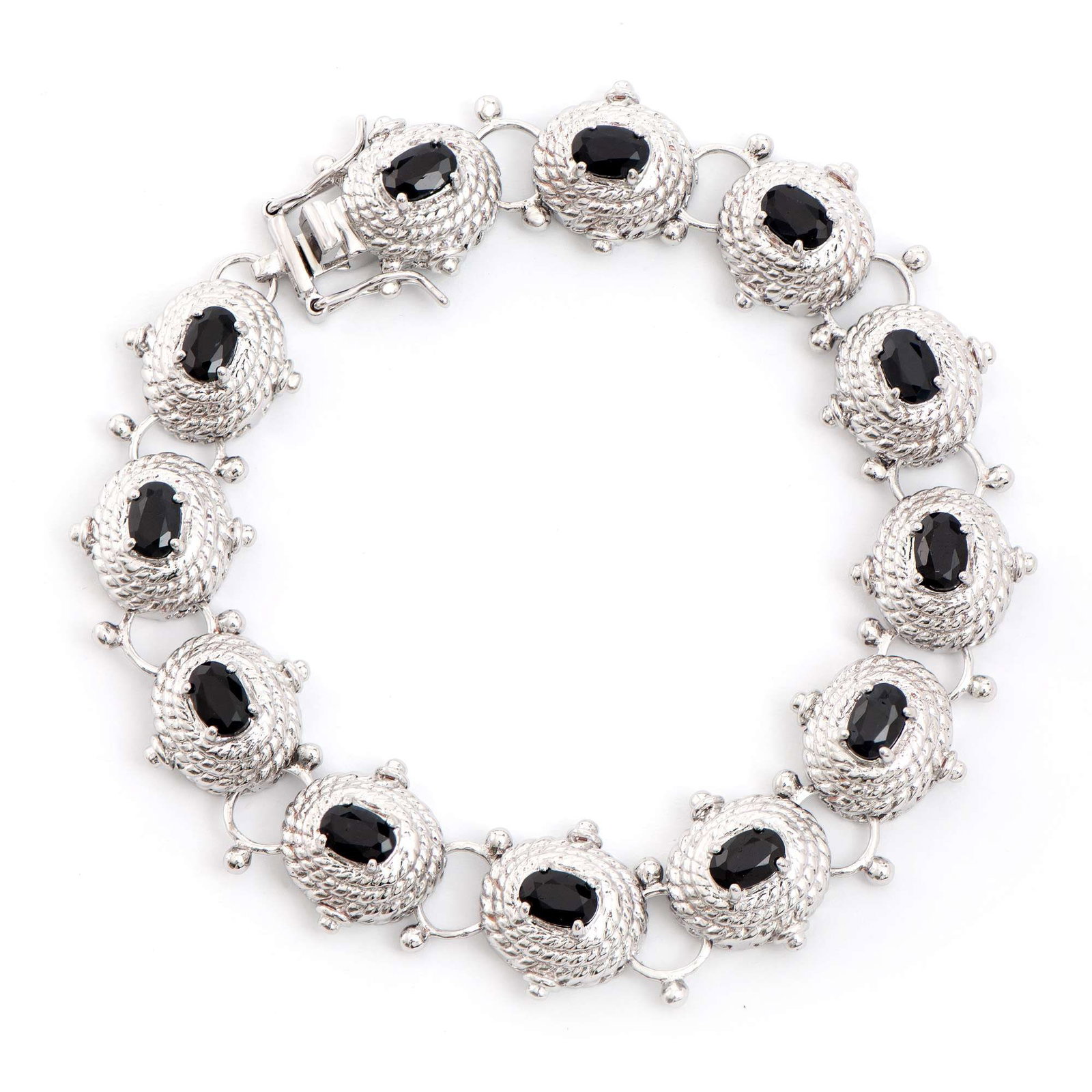 7.45 ctw Sapphire Rhodium Plated Designer Antique Style Bracelet 8.1 in: Title: 7.45 ctw Sapphire Rhodium Plated Designer Antique Style Bracelet 8.1 in Stone 1: Black Sapphire Color: Black Shape: Oval Size: 6x4 Quantity: 12 CTW: 7.45 Plating Material: Rhodium Primary Mater