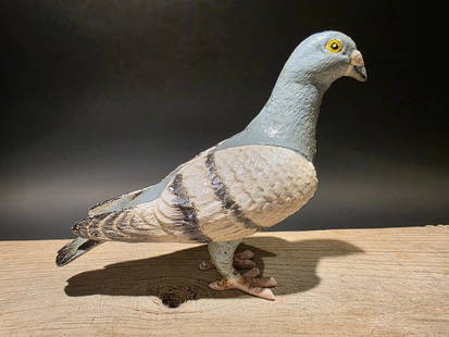 Antique Vintage Style Cast Iron Pigeon Decoy: 8 1/2" Long x 6" Tall Such neat reproduction antique iron pigeon. Surprisingly heavy. Solid piece. It appears the pieces are cast and hand welded together. Slightly aged patina makes it look and feel