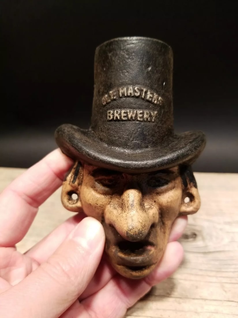 Cast Iron Ole Masters Brewery Beer Bottle Opener: 3 5/8" Tall x 3 1/2" Wide Great reproduction cast iron bottle opener. This piece was made to look just like an antique, but is new. All of our items come with a 100% customer satisfaction guarantee. A