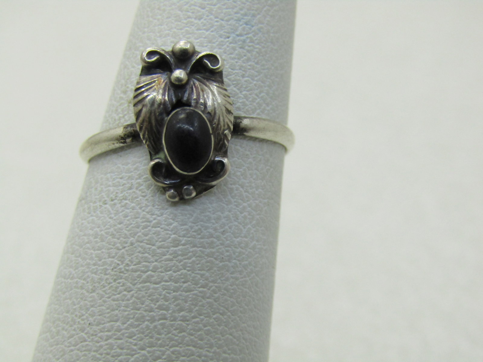 Vintage Sterling Southwestern Onyx Ring, Sz. 4.5, 1.24 gr., 1960's-1970's: Vintage Sterling Southwestern Onyx Ring, Sz. 4.5, 1.24 gr., 1960's-1970's, marked sterling and tested. Not signed by the maker. Bezel-set oval onyx that is appx. 4.5mm by 3.5mm, Southwestern, double f