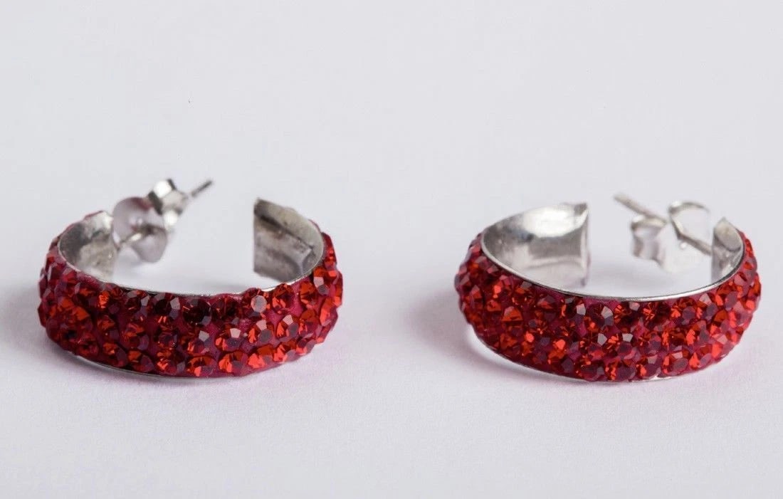 Red Rhinestone Enamel and Sterling Silver Hoop Earrings: Title: Red Rhinestone Enamel and Sterling Silver Hoop Earrings Description: Very elegant and sparkling earrings made of sterling silver with rhinestones?. Dead stock vintage?. Circa 1980?s?. The earri