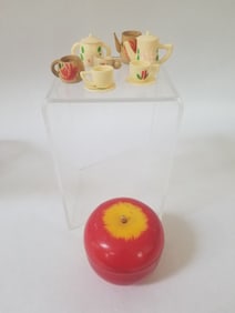 Plastic apple with 7 toys