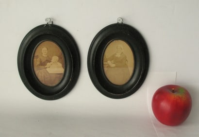 Pair of antique wood oval miniature portrait frames.