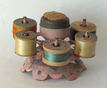 Antique painted metal revolving spool caddie.