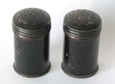 Pair of antique tinsmith made spice shakers.