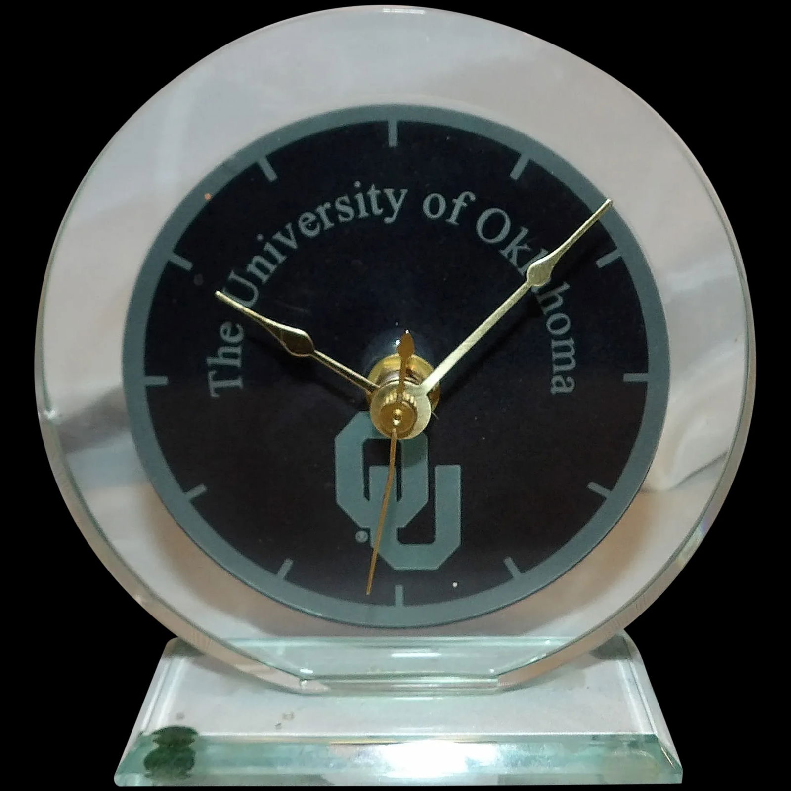 University of Oklahoma Glass Clock: This University of Oklahoma Glass Clock works and keeps perfect time. Quartz movement- battery operated. Measures 5 ¼” Tall x 4” x 2” Base. Shipping: Domestic: Flat-rate of $17.