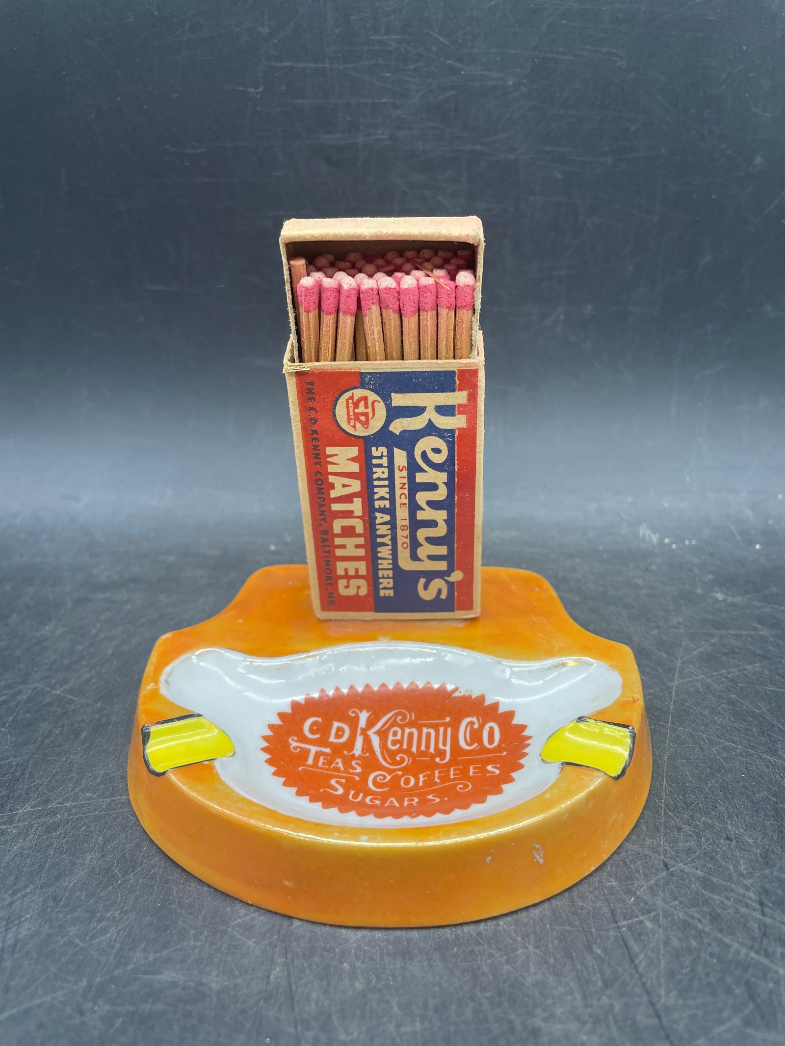 C. D. KENNY TEAS, COFFEES & SUGAR ADVERTISING PREMIUM ASHTRAY W MATCH BOX: Title: C. D. KENNY TEAS, COFFEES & SUGAR ADVERTISING PREMIUM ASHTRAY W MATCH BOX Date/Period: pre-1936 Dimension: Approx. 4 x 3 Material: --- Additional Information: C. D. KENNY TEAS, COFFEES & SUGAR 