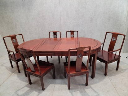 Vintage Asian Rosewood Carved Longevity Extending Dining Table and 8 Chairs: Vintage from before 2000 Materials: rosewood, wood, cherry, brass, metal Vintage Imported Asian Rosewood Carved Longevity Extending Dining Table and 8 Chairs Intricately handcrafted from solid rosewoo