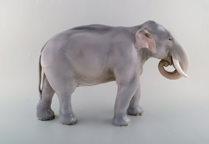Theodor Madsen for Royal Copenhagen. Rare porcelain figurine. Colossal elephant. Dated ca. 1910.