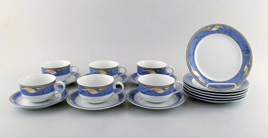 Royal Copenhagen. Set of six "Magnolia" tea cups with saucers and six plates. Late 20th century.