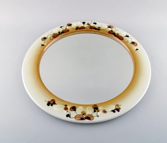 Ellen Malmer for Royal Copenhagen. Large round mirror in glazed faience decorated with flowers on