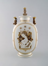 Royal Copenhagen. Lidded art deco jar with the Virgin Mary and the Jesus Child. Three praying
