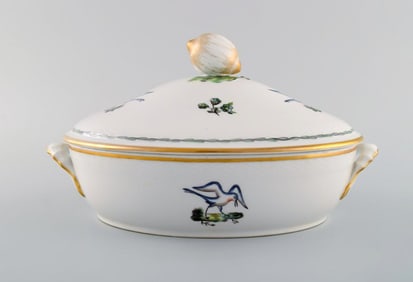 Royal Copenhagen lidded tureen in hand-painted porcelain with bird motifs and gold decoration. Early