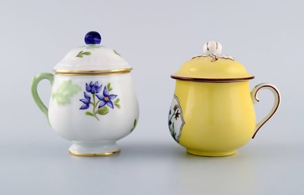 Two antique cream cups in hand-painted porcelain. Early 20th century.