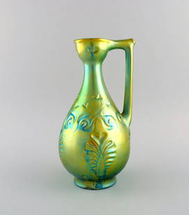 Zsolnay jug in glazed ceramics modeled with foliage. Beautiful eosin glaze. 1960s.: Zsolnay jug in glazed ceramics modeled with foliage. Beautiful eosin glaze. 1960s. Measures: 28 x 15.5 cm. In excellent condition. Stamped. Reserve: $630.00 Shipping: Domestic: Shipping rates are dete