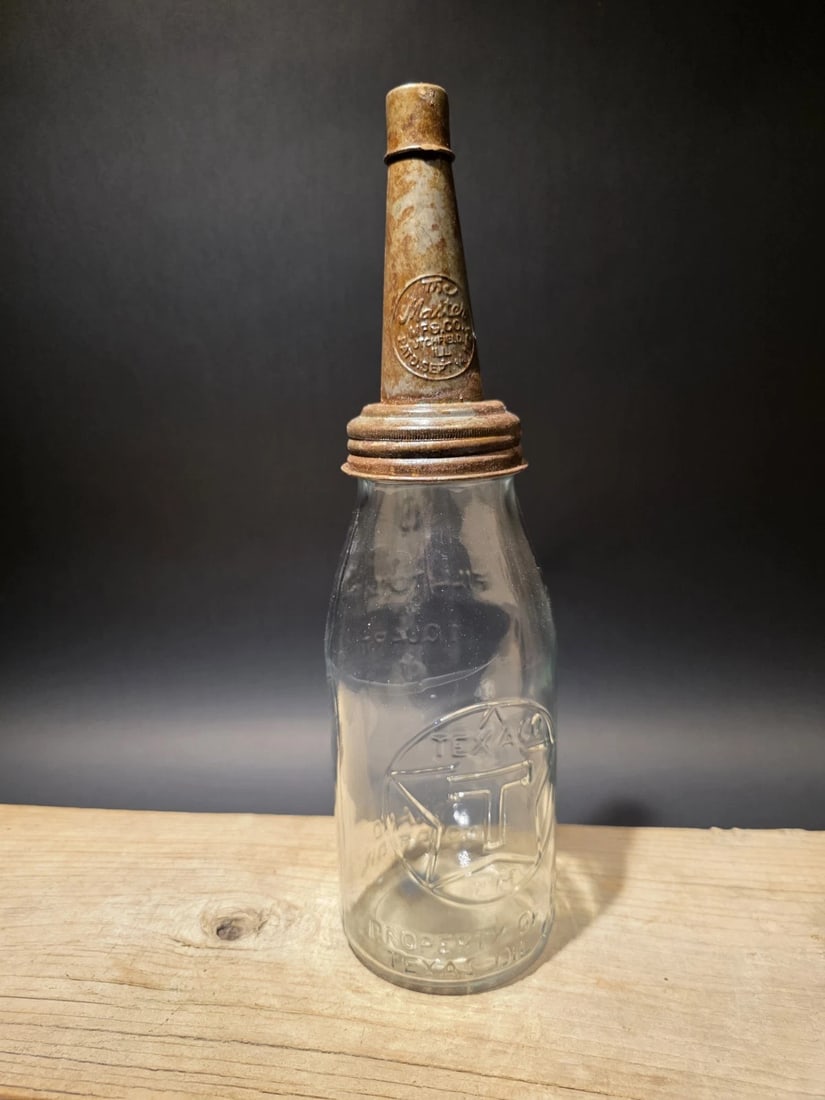 Glass Texaco Oil Bottle w Spout: 11" Tall 4" Wide Such a neat reproduction glass oil bottle. Wonderful signs of wear and distress. Hard to tell its age! Looks great on display! Reserve: $25.00 Shipping: Domestic: Flat-rate of $17.00 