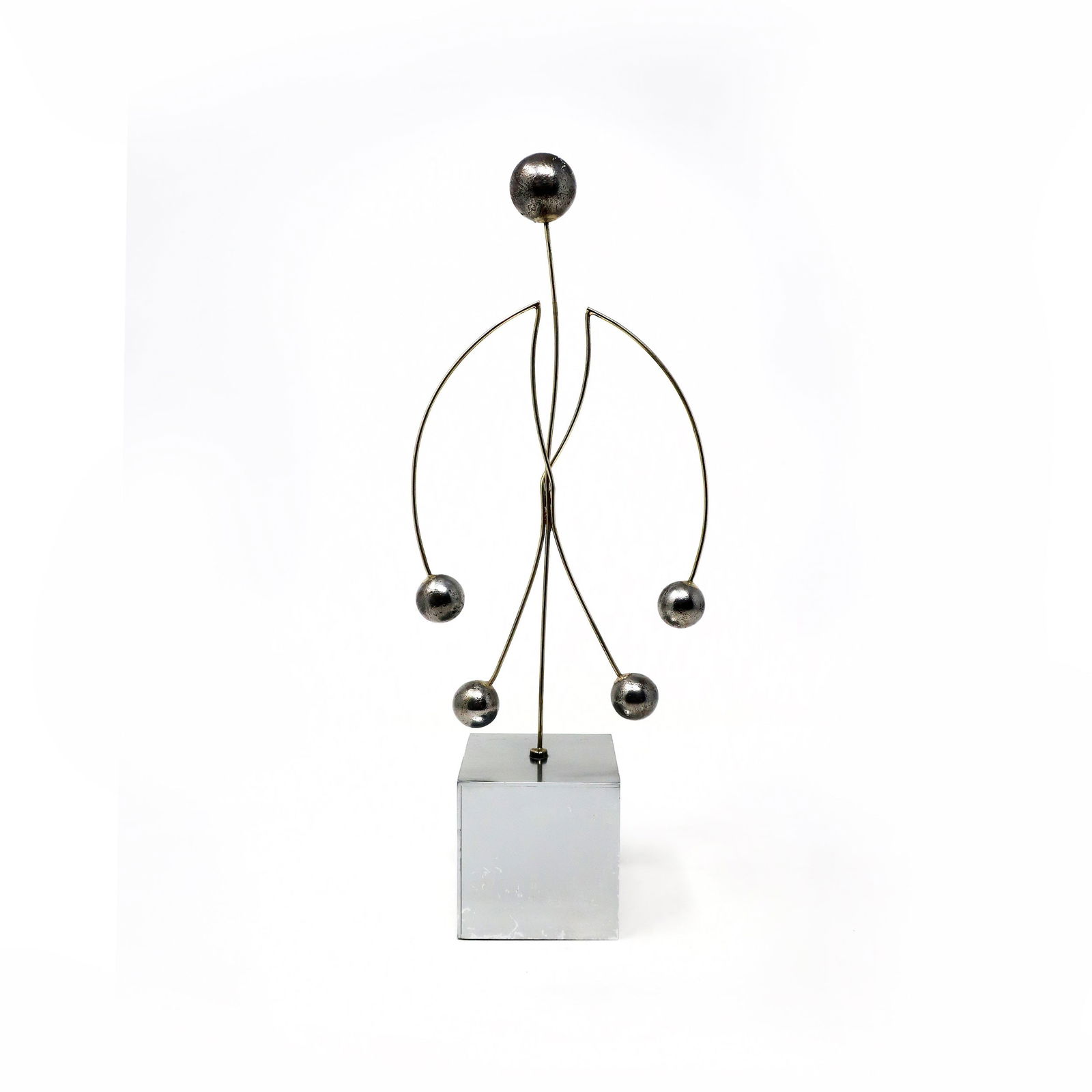Italian Modern Metal Figurative Kinetic Sculpture: A vintage metal kinetic sculpture in the figure of a human body. Set on a weighted chrome base with a figure constructed from heavy gauge metal wire with weighted metal balls for hands, feet, and head