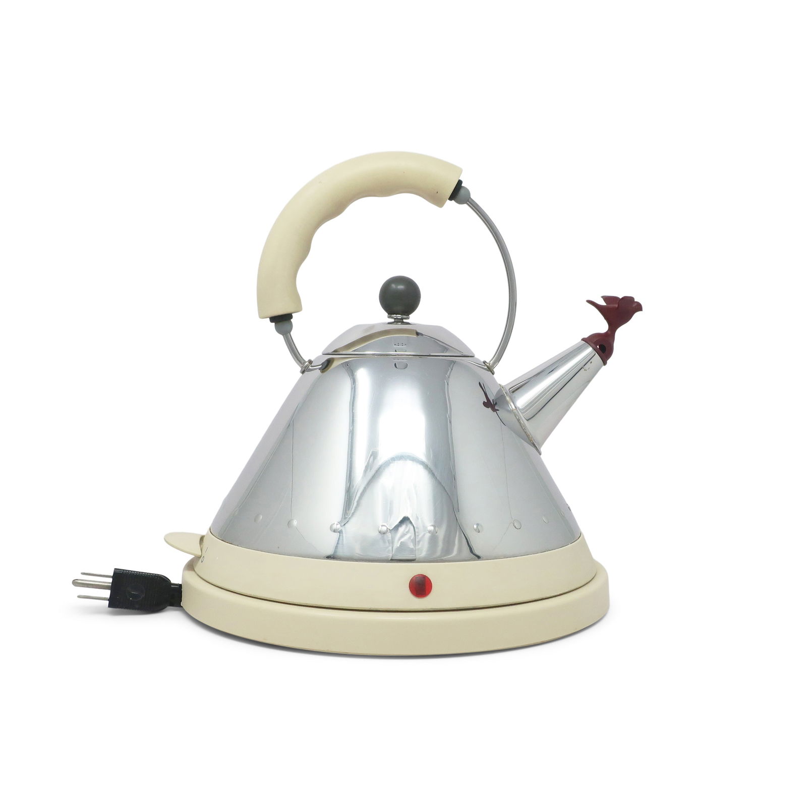 Cream MG32 Electric Kettle by Michael Graves for Alessi: Expanding on his iconic 9093 kettle design launched in 1985, which has been Alessi's number one seller for the past 30 years with over 2 million units sold, the MG32 uses Michael's Graves kettle form