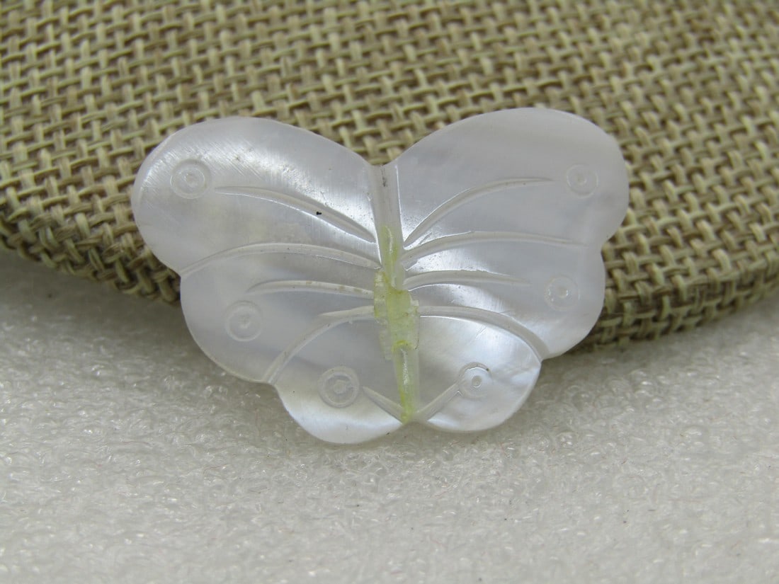 Vintage Carved Mother-of-Pearl Butterfly Brooch, or Moth,: Vintage Carved Mother-of-Pearl Butterfly Brooch, or Moth, 1-3.8" wide and 7/8" tall, carved line down the center as its torso with carved details in the wings. 1960's-1970's, Gold tone modern C-clasp