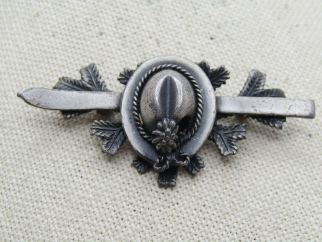 Vintage Germany Bavarian Hat/Ski Brooch, 1950's-1960's: Vintage Germany Bavarian Hat/Ski Brooch, 1950's-1960's. Baviarn hunter's or skiing. Pewter tone - or pewter - with a ski pole under the hat that has edelweiss on the end and sitting over pine branches