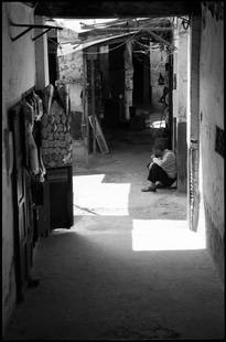Edition of 10 - Shadows; 2017: Edition of 10 - Shadows, The Medina, Fes, Morocco,, Silver Gelatin Photograph Edition of 10 + 5 APs. Front: Signature and edition number with artists blind stamp. Back: Ink stamp and print details.