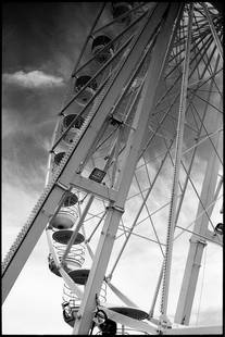 Edition of 10 - Ferris Wheel; 2011: Edition of 10 - Ferris Wheel, Great Yarmouth, UK, Silver Gelatin Photograph Edition of 10 + 5 APs. Front: Signature and edition number with artists blind stamp. Back: Ink stamp and print details.