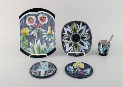 Tilgmans, Sweden. A collection of glazed ceramics decorated with girls and floral motifs. 1960s.