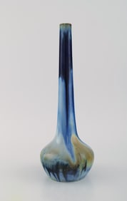 Gentil Sourdet, France. Long necked vase in glazed stoneware. Beautiful glaze in shades of blue and