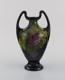 Regina, Holland. Antique art nouveau vase in glazed ceramics with hand-painted flowers and foliage.