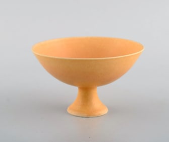 European studio ceramicist. Unique bowl on base in glazed ceramics. Beautiful glaze in light yellow
