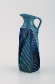 Vilhelm Bjerke Petersen (1909-1957) for Rörstrand. Fasett jug in glazed ceramics. Mid-20th