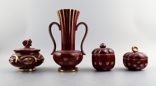 Collection of 'Red Rubin' pottery with red glaze with gold, Upsala-Ekeby, Gefle. Design Arthur