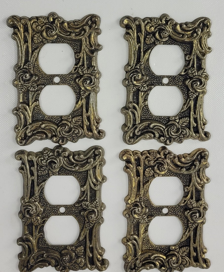 Vintage Gold Hardware Socket Cover Receptacle French Design Set of 4: 4 Vintage Gold Hardware Socket Cover Receptacle French Design Beautiful Cover that will be an eye catching detail on your wall. Measures 5"H x 3"W Heavy wear and scratches to the finish. Thank You INT