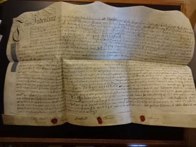 1726 Beautifully Penned Vellum Indenture Red Wax Seals: A beautifully penned English vellum indenture dated 1726 being the conveyance of property at Speldhurt in the county of Kent between members of the Drury family and Johanna Cock. Fancy printed vignett