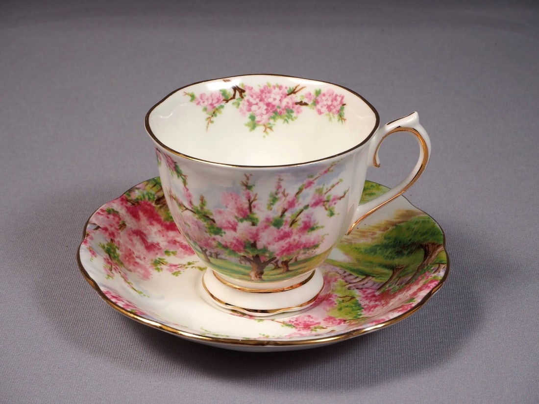 Royal Albert Blossom Time Coffee Tea cup Saucer Set Bone China England: This is a set of Coffee/Teacup and Saucer from the famous Blossom time Collection. The set is made by Royal Albert in England. It is properly marked with Royal Albert back stamp. The pattern was desig
